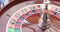 A close up of a blackjack dealer's hands in a casino, very shallow depth of field.