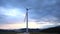 A close-up of the blades of the washed huge wind turbine against the sky.