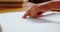 Close-up of blind Asian schoolboy hand reading a braille book in classroom at school 4k