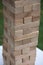 Close up blocks wood game. Jenga game. Wooden blocks. Strategy game. Classic family entertainment