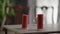 Close-up blown out red candles with smoke on table. House decoration on holiday indoors.