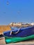 Close up blue boat in harbour with ramparts beyond, Essaouira, Morocco