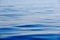 Close-up. Blue calm sea water. Marine water background. Calmness, relaxation