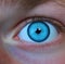 Close up of blue eye of caucasian man looking at camera