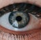 Close up of blue eye of caucasian man looking at camera