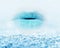 Close-up of blue girl lips with mist and icy snow