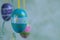 Close up blue painted Easter eggs, hagainst flamed  background. Space for text