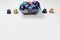 Close up blue, purple and golden coffee capsules in shopping basket