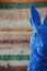 Close up of blue rabbit easter bunny peeking into frame