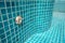 Close up of blue swimming pool tiled floor. Architect and construction concept. Material and design concept. Interior and