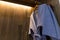 Close-up blue twin bathrobe in wooden wardrobe of luxury hotel