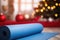 Close up of blue yoga mat at home decorated for Christmas, New Year. Healthy lifestyle, weight loss, New Year's