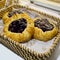 Close up of Blueberry Pies in basket at bakery shop