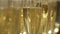 Close-up blurred view of champagne glasses with a cool delicious champagne or white sparkling wine on a table. Action