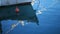 Close up boat with red buoy parked in marina