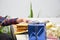 Close up of body part female hand preparing a gift at the table