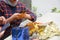 Close up of body part female hand preparing a gift at the table