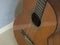 Close up body of spanish acoustic guitar focused on strings