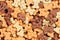 Close up of bone shaped dog treats in different colors and flavoures for rewarding and training small dogs and puppies. Macro food