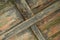 A close-up of the bottom of an old wooden rowing boat