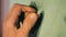 Close up of a bouldering rock being clenched in a male fist