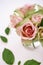 Close up bouquet of pink spring roses in glass