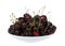 Close up on bowl of bing cherries isolated