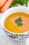 Close up of a bowl of carrot, pumkin and sweet potato soup