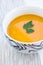 Close up of a bowl of carrot, pumkin and sweet potato soup