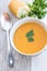 Close up of a bowl of carrot, pumkin and sweet potato soup