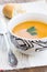 Close up of a bowl of carrot, pumkin and sweet potato soup