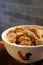 A close up of a bowl of Chinese sesame cookies.