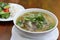 Close up of a bowl Chinese style on wooden background ,Beef Noodle Soup