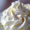 A close up of a bowl filled with whipped cream on top, AI