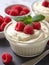 A close up of a bowl of food with raspberries, Valentine's day desserts.