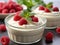 A close up of a bowl of food with raspberries, Valentine's day desserts.