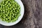 Close up of a bowl of fresh English pea