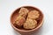 a close up of a bowl of fried stuffed tofu