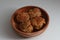 a close up of a bowl of fried stuffed tofu