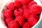 Close up of bowl of raspberries