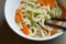 Close up bowl of udon noodle soup