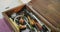 Close up of box full of tools in leather workshop