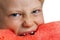 Close-up of boy devouring water melon