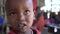 Close Up Of Boy From Maasai Tribe Africa Tearing His Eye In Small School Class