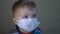 Close-up of a boy with mask. Infected sick child.