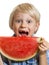 Close-up of boy taking bite of water melon