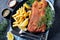 Close-up of Breaded hake fillet on a plate