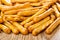 Close up of breadsticks with poppy on wooden table