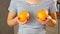 Close-up of breasts in young woman`s t-shirt.