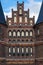 Close up of the brick-built Holsten Tor old city gate of LÃ¼beck reading the golden letters concordia domi foris pax